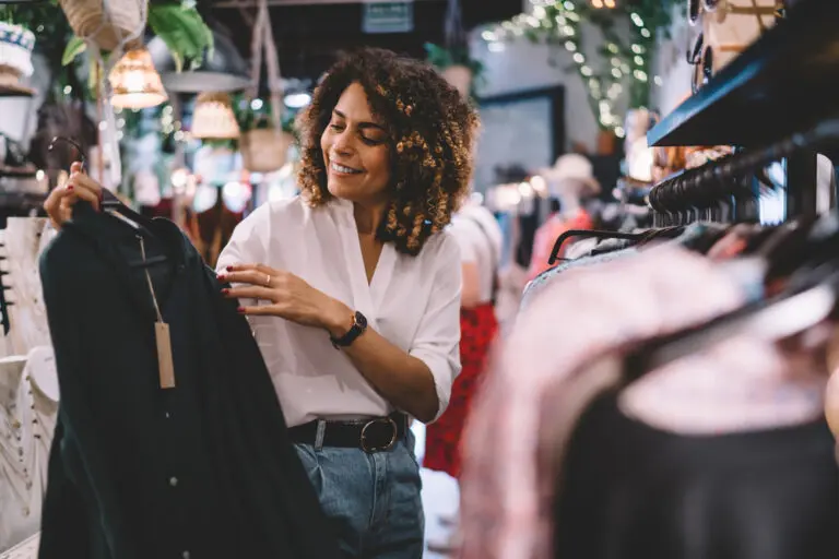 female is smiling while checking apparel